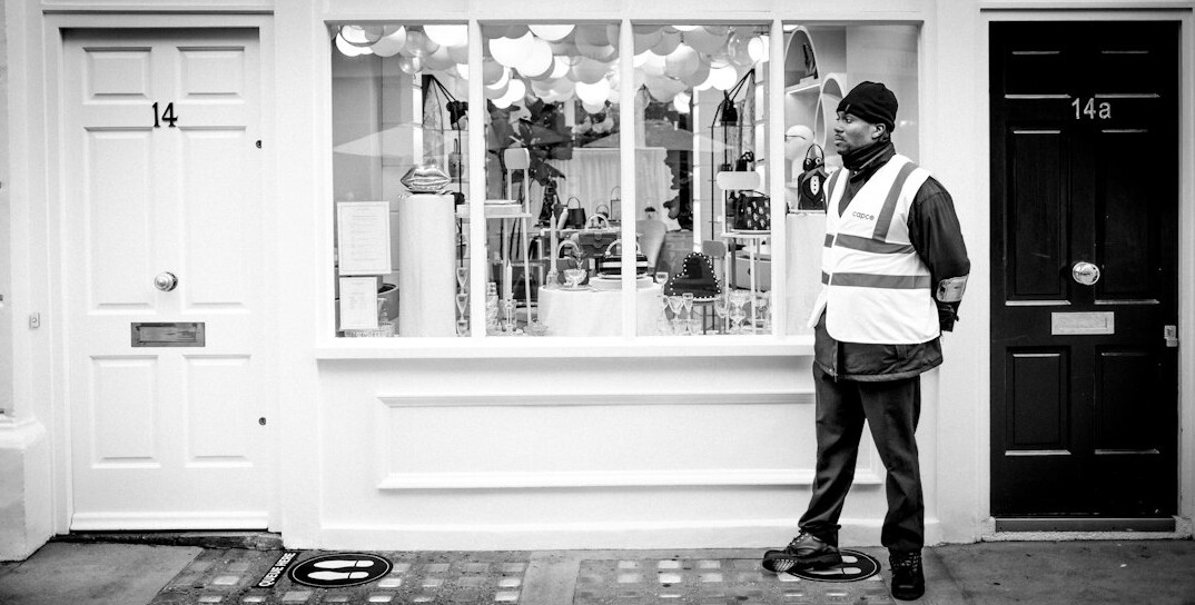 store detective watching customers